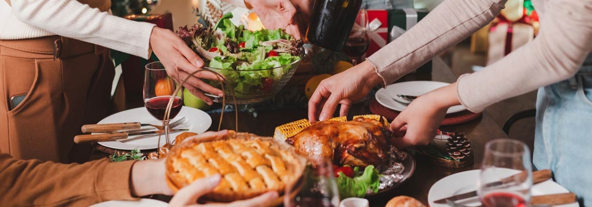 Group of young adult Asian Friends holiday party dinner at home around the table